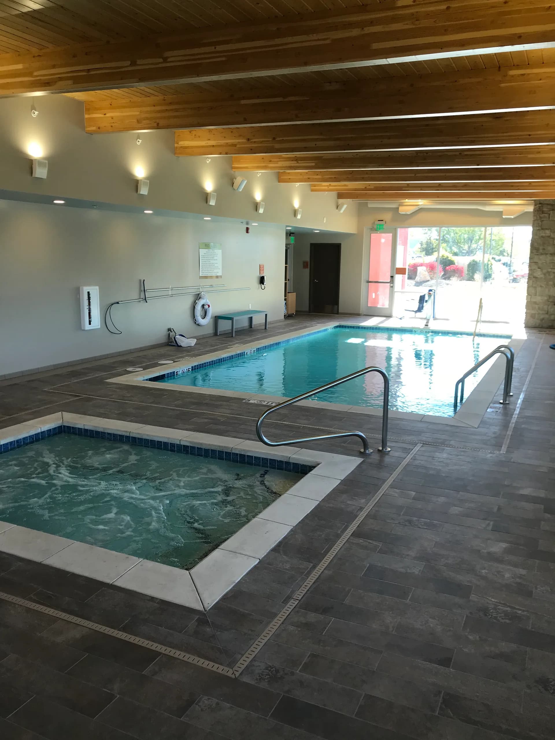 gunite swimming pool with integrated hot tub spa